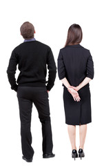 Back view of couple. beautiful friendly girl and guy together.