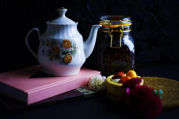 teapot and cup of tea on wooden background