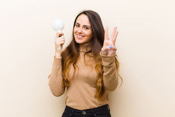 young pretty woman with  bulb, having an idea