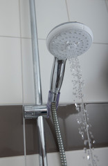 Maintenance of houses. The showerhead. Bathroom. Waterjet. Waterdrops. 