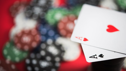 A pair of two aces with poker chips