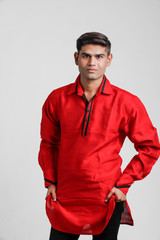 Indian / Asian man in red shirt and showing multi pal expression over white background 