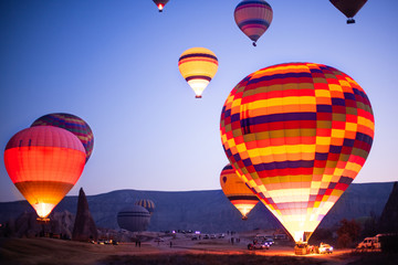 Hot air balloons flying at the sunrise at Cappadocia
