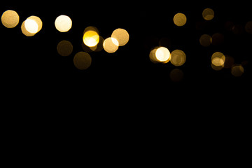 Abstract gold bokeh with black background - obrazy, fototapety, plakaty