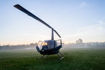 Selbstklebende Fototapeten Helicopter Four Seater Aircraft Parked Dawn Grass Field © ChrisVanLennepPhoto