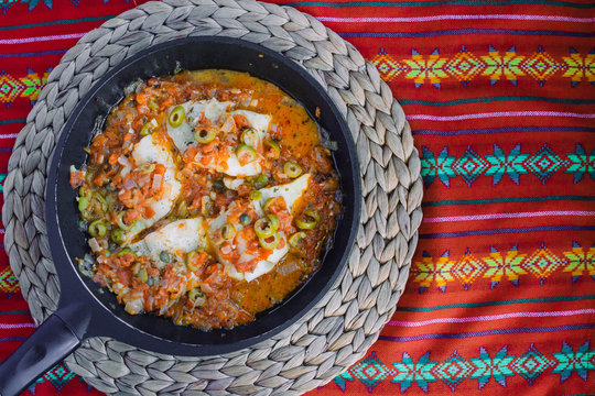 Pescado a la veracruzana recipe with empty space for text, colorful background