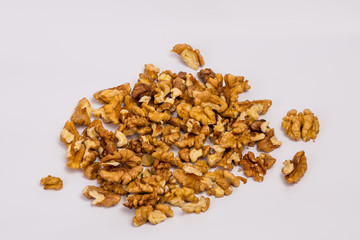 Shredded walnuts on a white background. Useful snack.