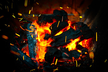 Fototapeta na wymiar Bonfire with sparks flying around