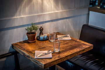 rustic country style restaurant with white walls,  table seating and lamps