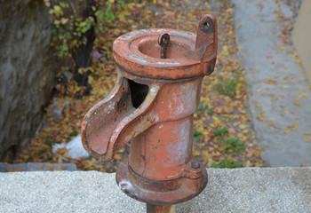 old rusty water pump in the garden