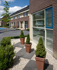 Fototapeta na wymiar Biddinghuizen. Modern Dutch architecture. Houses. Residential housing. Netherlands. Flevopolder
