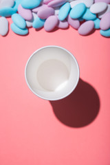 Paper cup of coffee on a pastel background
