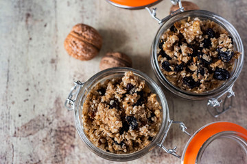 Vegetarian dish: muesli with nuts, raisins, honey, cinnamon and sesame seeds