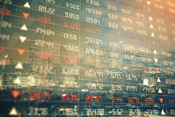 Financial graph on night city scape with tall buildings background multi exposure. Analysis concept.