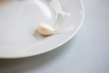 Fototapeta na wymiar close up of white garlic clove on white