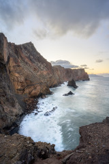 sunset over rocky coastlilne of madeira