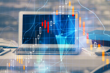 Financial graph colorful drawing and table with computer on background. Double exposure. Concept of international markets.