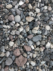 Background of multicolored stones of different shapes, background