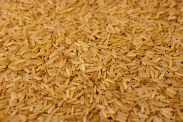 Pile of brown rice uncooked background
