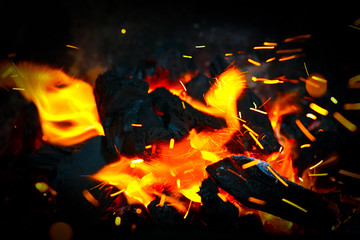 Fototapeta na wymiar Bonfire with sparks flying around