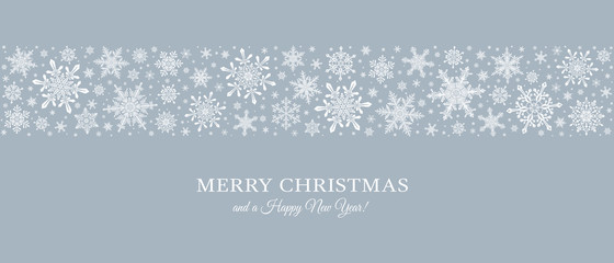 Decorative Christmas background with bokeh lights and snowflakes.