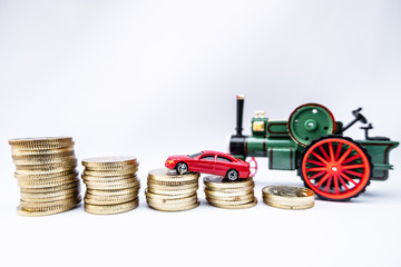 Toy cars with gold coins show To growth, saving money for car loans