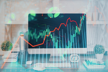 Forex graph hologram on table with computer background. Double exposure. Concept of financial markets.