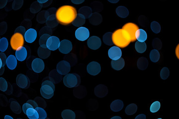 Fabulous bokeh of moderate gray circles combined with orange. Abstract festive background for banner. Horizontal.