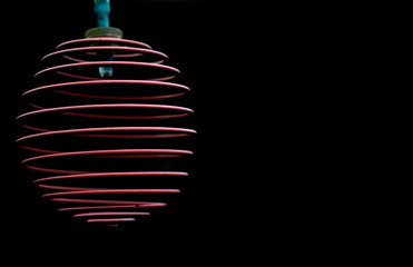 red spiral light against a dark background