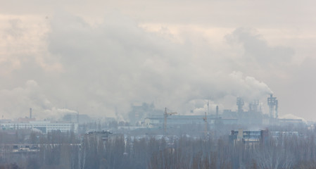 Fototapeta na wymiar Toxic smoke from pipes at the factory