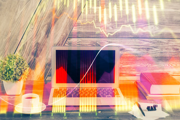 Multi exposure of chart and financial info and work space with computer background. Concept of...