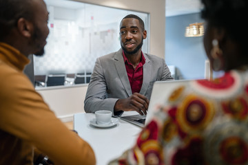 African Couple Meeting With Black Male Financial Advisor bank manager Relationship Counsellor In Office - obrazy, fototapety, plakaty