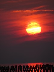 Beautiful sunset, sunrise sky over Baltic Sea (Chalupy), Hel Peninsula. Golden hour. Dramatic sea and sky.