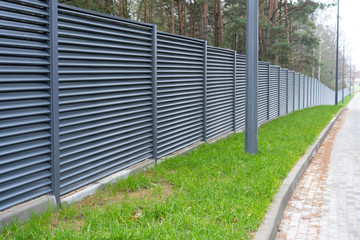 blank metal fence in the village