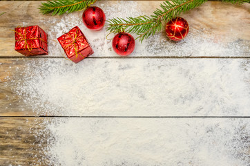 Christmas background with Christmas tree and Christmas decorations on wooden Board with copy space. view top