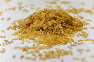 Pile of brown rice uncooked isolated and on white background