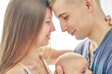 young couple with newborn baby. selective focus closeup