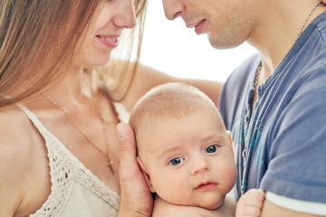 young couple with newborn baby. selective focus closeup