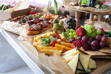 appetizer: fruits, vegetables, cheese, greens, festive table decor