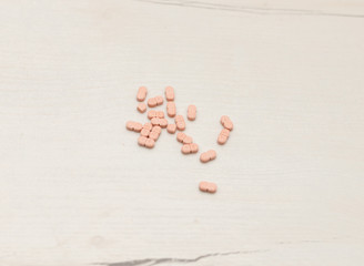 Colorful medical pills on the table, for your text
