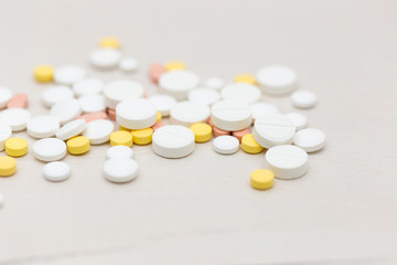 Colorful medical pills on the table, for your text