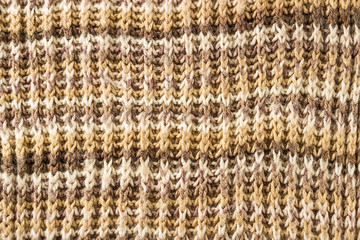 Fototapeta premium Knitted background. Knitting Pattern. A sample of knitting from wool.