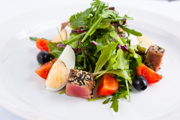 tuna salad and arugula with cherry tomatoes