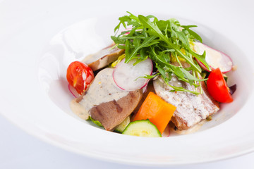 beef salad with greens and vegetables