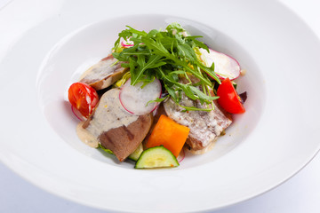 beef salad with greens and vegetables