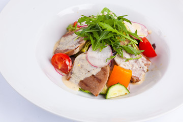 beef salad with greens and vegetables