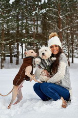 Girl with dogs in winter.