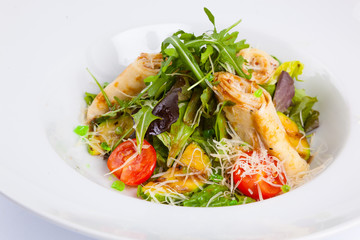 salad with stuffed pancakes and greens