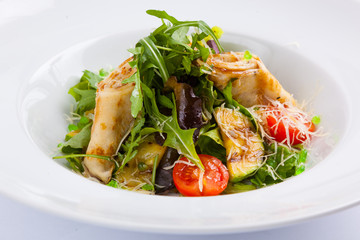 salad with stuffed pancakes and greens