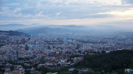 Fototapeta na wymiar View of the stone city, dawn over Barcelona.
